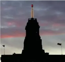  ?? RICHARD LAUTENS/TORONTO STAR FILE PHOTO ?? The weather beacon on top of the Canada Life building on University Ave. has been a mainstay of the Toronto skyline for decades.