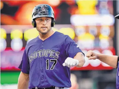  ?? ROBERTO E. ROSALES/JOURNAL ?? MLB veteran Matt Holliday made his debut with the Albuquerqu­e Isotopes on Friday. The 38-year-old outfielder hopes to chip in for the Rockies’ drive for a playoff spot this season.