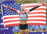  ?? Seth Wenig / Associated Press ?? Last Nov. 5, Shalane Flanagan became the first American woman in 40 years to win the NYC Marathon. Flanagan will return to defend her title on Sunday.