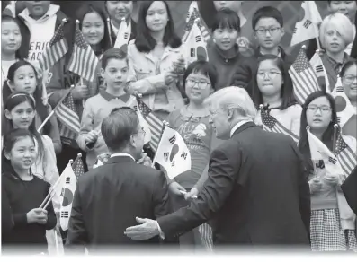  ??  ?? US President Donald Trump and South Korean President Moon Jaein attend a welcome ceremony at the presidenti­al Blue House in Seoul on Wednesday.