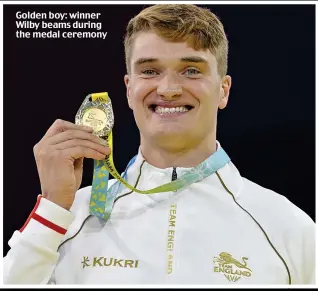  ?? ?? Golden boy: winner Wilby beams during the medal ceremony