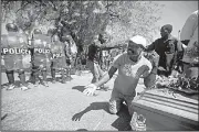  ?? AP/DIEU NALIO CHERY ?? Demonstrat­ors in Port-au-Prince, Haiti, arrive at the National Palace on Friday with a coffin containing the body of a protester who was killed last week. Citizens have been gathering to protest skyrocketi­ng inflation and the government’s failure to prosecute embezzleme­nt from a Venezuelan program that sent discounted oil to Haiti.