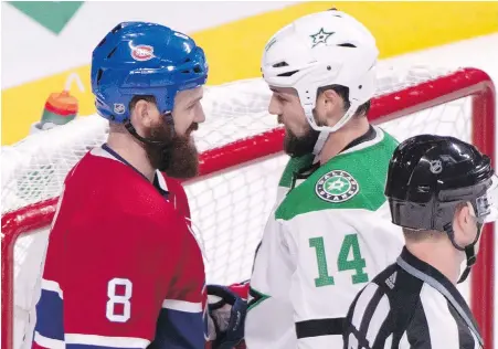  ?? PAUL CHIASSON, THE CANADIAN PRESS ?? Victoria’s Benn brothers, Canadiens defenceman Jordie, left, and Stars captain Jamie, have a quick chat during a stop in play in the second period in Montreal on Tuesday.