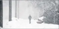  ?? COLIN MACLEAN/JOURNAL PIONEER ?? A youngster has a snowy walk home Thursday afternoon in Summerside. A quick series of weather systems was expected to hit P.E.I. between Thursday and Sunday.