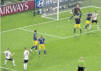  ?? SERGEI GRITS/THE ASSOCIATED PRESS ?? Germany's Toni Kroos, far left, drilled the long-range winner past goalkeeper Robin Olsen — just inside the right post.