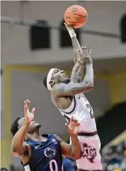  ?? Phelan M. Ebenhack/Associated Press ?? Texas A&M guard Tyrece Radford, right, scored 14 points in the Aggies’ 89-77 win over Penn State.