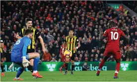  ??  ?? Sadio Mané scores Liverpool’s second goal against Watford at Anfield. Photograph: Simon Stacpoole/Offside/Getty Images