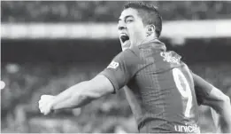  ??  ?? Nou Camp Stadium, Barcelona, Spain - 3/12/16. Barcelona’s Luis Suarez celebrates after scoring their first goal during the ‘Clasico’