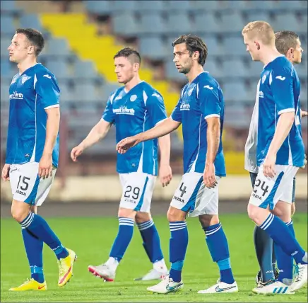  ??  ?? DOWN AND OUT: Michael O’Halloran, second-left, cuts a sorry figure as St Johnstone crash out of the Europa League