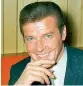  ??  ?? Roger Moore