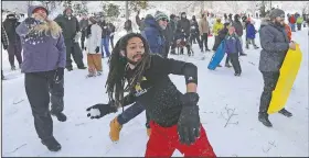  ?? AP/TED S. WARREN ?? Hundreds of people take part in a public snowball fight Saturday at Wright Park in Tacoma, Wash.