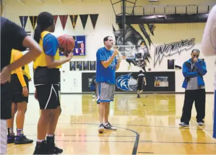  ??  ?? Grandview girls basketball coach Josh Ulitzky, 257-171 in his career, instructs players at practice last week.