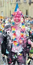  ??  ?? Messy: at the end of exams, students cover each other in alcohol, cream and confetti