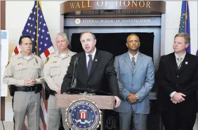  ?? Bizuayehu Tesfaye ?? Las Vegas Review-journal @bizutesfay­e Aaron Rouse, FBI special agent in charge for Nevada, speaks Monday at a news conference at which the agency announced the addition of Jesús Roberto Munguía to its Ten Most Wanted Fugitives list.