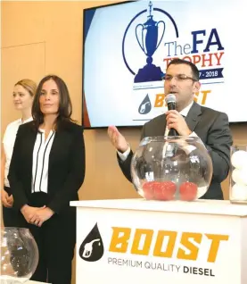  ??  ?? Dr. Angelo Chetcuti (R), Malta FA General Secretary speaks during the draws together with Dr. Cornelia Zammit German, Falzon Group CEO Photo: Domenic Aquilina