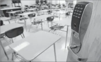  ?? RICHARD ALAN HANNON/THE ADVOCATE VIA AP ?? A bullet-resistant lock installed by NetTalon Security Systems on the door of a classroom at McKinley Middle Magnet School in Baton Rouge, La.