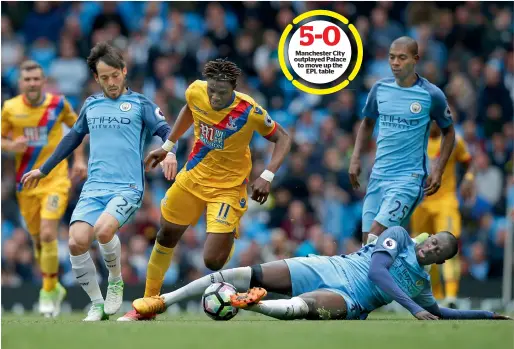  ?? Reuters ?? Manchester City’s Yaya Toure, Fernandinh­o and David Silva in action with Crystal Palace’s Wilfried Zaha. —