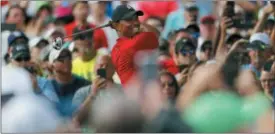  ?? MIKE CARLSON — THE ASSOCIATED PRESS ?? Tiger Woods tees off on the 16th hole during the final round of the Valspar Championsh­ip golf tournament Sunday in Palm Harbor, Fla.