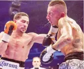  ??  ?? Samuel Vargas (R) slugs it out with Danny Garcia