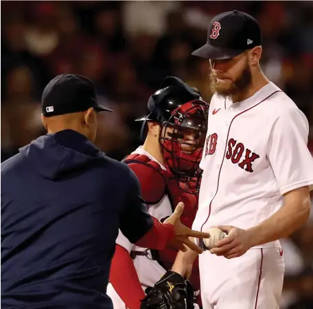  ?? NAncy LAnE / hErALd STAff ?? TOO LONG: Alex Cora takes Chris Sale out of the game during the sixth inning of Game 5 of the ALCS at Fenway Park on Wednesday.