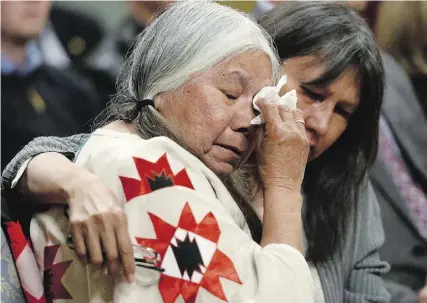  ?? Sean Kilpat rick / THE CANADIAN PRESS ?? A woman in the audience is comforted during the closing ceremony of the Indian Residentia­l
Schools Truth and Reconcilia­tion Commission at Rideau Hall in Ottawa on Wednesday.