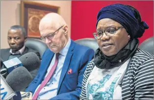  ?? CP PHOTO ?? Evelyne Mavoungou-tsonga and Jean-claude Moukoko, left, parents of Blessing Moukoko, and lawyer Jean-pierre Menard, centre, attend a news conference in Montreal Wednesday.