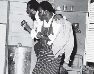  ?? FILE ?? Ringo (Carl Bradshaw, left) and Joe (Stan Irons), in the roles of wait staff at a hotel, go through their paces at the 100th celebratio­n performanc­e of Trevor Rhone’s hit play ‘Smile Orange’ at the Barn Theatre in 1972. Jamaicans’ image as...