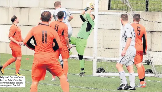  ??  ?? My ball Doune Castle keeper Adam Smulski commands his penalty area against Dalziel