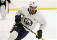  ?? JASON FRANSON — THE CANADIAN PRESS VIA AP, FILE ?? In this file photo, Edmonton Oilers’ Connor McDavid (97) skates during NHL hockey training camp in Edmonton, Alberta. McDavid heard teammates talking about another potential lockout when he entered the NHL in 2015. As he became one of hockey’s best players and signed the richest annual contract in the league, McDavid protected himself against that lockout even if he’s optimistic it will be avoided the way work stoppages in 2004-05 and 201213 weren’t.