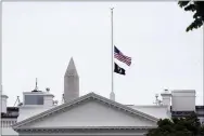  ?? SUSAN WALSH — THE ASSOCIATED PRESS ?? The American flag flies at half-staff at the White House on Thursday. The Biden administra­tion commemorat­ed 1 million American lives lost due to COVID-19.