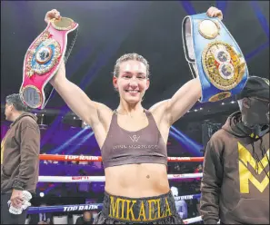  ?? Mikey Williams Top Rank Inc via Getty Images ?? Mikaela Mayer poses with the WBO and IBF junior-lightweigh­t titles after defeating Maiva Hamadouche on Friday at Virgin Hotels Las Vegas.