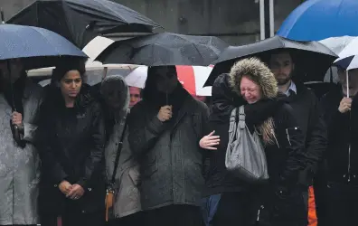  ?? AFP ?? Left, a minute’s silence at the south side of London Bridge in the UK capital on June 6 last year, in memory of the victims of the terrorist attacks three days earlier