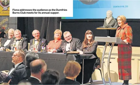  ??  ?? Fiona addresses the audience as the Dumfries Burns Club meets for its annual supper.