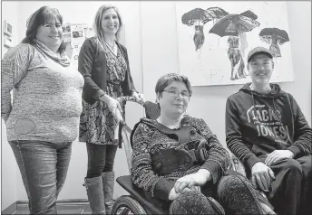  ?? BRENDAN AHERN/THE NEWS ?? Cherity Johnston was the first person in Pictou County to test out the new Hippocampe all-terrain wheelchair. With Cherity are, from left, Summer Street support staff member Leighanne MacDonald, Active Pictou County coordinato­r Sally O’Neill, and Devin Forbes, chairman of the Let Abilities Work Partnershi­p.