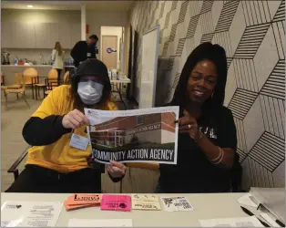  ?? PHOTO BY KAREN CRANNELL ?? Downtown Streets Team member Austin Miles, left, and case manager Alicia Miller staff the Community Action Agency station at a Feb. 10poverty simulation at Sunnyvale Community Services. Past and present members of Leadership Sunnyvale and Leadership Mountain View classes were assigned a family at random for the simulation, meant to demonstrat­e what a typical month living in poverty is like.