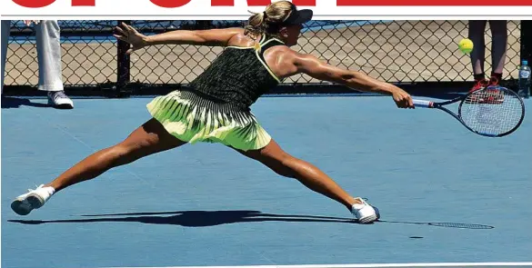  ?? MADSEN PHOTO: NEV ?? TOP SHOT: Hungary’s Dalma Galfi stretches for a backhand return during her Toowoomba Internatio­nal final win over England’s Kate Dunne last year.