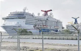  ??  ?? Carnival Cruise ships are seen docked at the Port of Tampa in Tampa, Florida, in March.