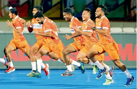  ??  ?? Members of the Indian team during a training session on Tuesday, eve of their World Cup opening match against South Africa in Bhubaneswa­r.