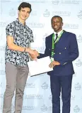  ?? ?? Wilson Katsande receiving his award from a South African Youth Engineerin­g and Science Symposium official