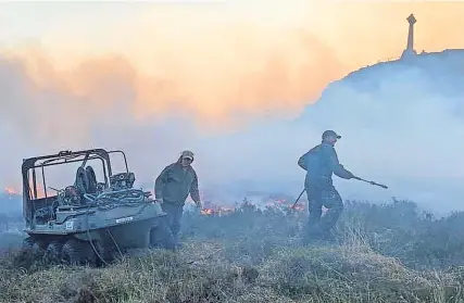  ?? ?? Safety concerns Gamekeeper­s tackling a wildfire last year