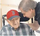  ?? KELSEY CRONIN FOR THE BOSTON GLOBE ?? Nick Bonanno talks with his father, World War II veteran Rosario “Russ” Bonanno, inside the VA nursing home in Bedford, Mass.