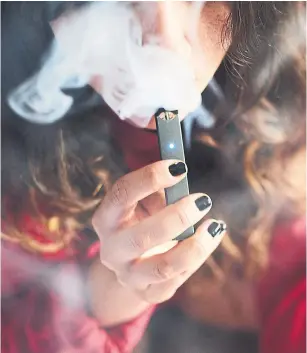  ?? GABBY JONES PHOTOS/BLOOMBERG ?? Juul Labs, the maker of the popular e-cigarette, is under fire for marketing it to teens.