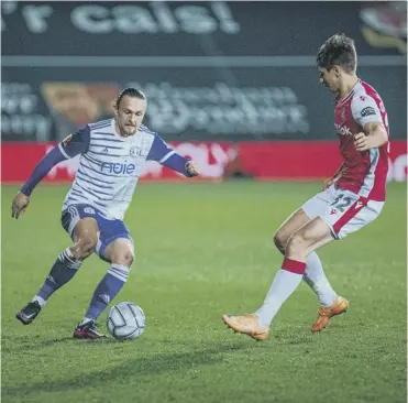  ?? ?? BELOW PAR: Jamie Thomas was one of several Town players who underperfo­rmed in their 3-1 defeat at Wrexham on Tuesday night. Photo: Marcus Branston.