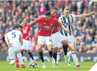  ??  ?? ■
Jesse Lingard tries to find a way through the West Brom defence.