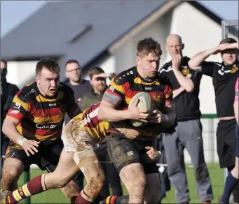  ??  ?? Michael Wells of Sligo RFC on the attack with Shane O’Hehir in support.