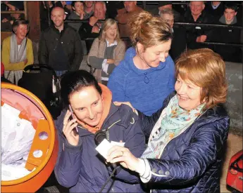  ?? Photo by Declan Malone ?? Geraldine Ashe - pictured with her sister Gráinne and Máiréad Lavery of the Farmers Journal (right) - phones up Diarmuid Begley to tell him he had just won Hannah and Harry, the Belgian Blue cow and her calf. Diarmuid, who was on holiday in Tenerife,...