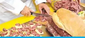  ??  ?? A farmer cuts boar salami during a demonstrat­ion of farmers, some members of the Coldiretti farmers’ associatio­n, against invasive wild boars in Rome’s central Piazza Montecitor­io outside Parliament. — AFP