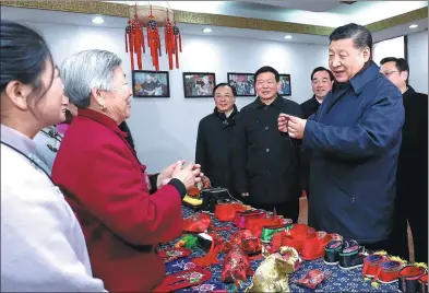  ?? JU PENG / XINHUA ?? President Xi Jinping speaks with villager Wang Xiuying, 80, who made a herbal sachet that he admired and wanted to buy in the Xuzhou village of Mazhuang in Jiangsu province on Tuesday. Xi, on an inspection tour, paid 30 yuan ($4.50) for the sachet.