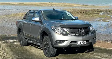  ?? DAMIEN O’CARROLL/STUFF ?? The Mazda BT-50 GSX Special Edition gets a load of extra kit for less money than the standard GSX.
Awful infotainme­nt system, those taillights are never gonna look right, so big...