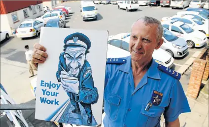  ?? Picture: MICHAEL PINYANA ?? JA WELL NO FINE: Superinten­dent Gavin Dovey is retiring from his job at the Braelyn Traffic Department after 39 years, many of which were spent as a traffic cop. The cartoon was given to him by his sister when he was promoted in the department in 1994